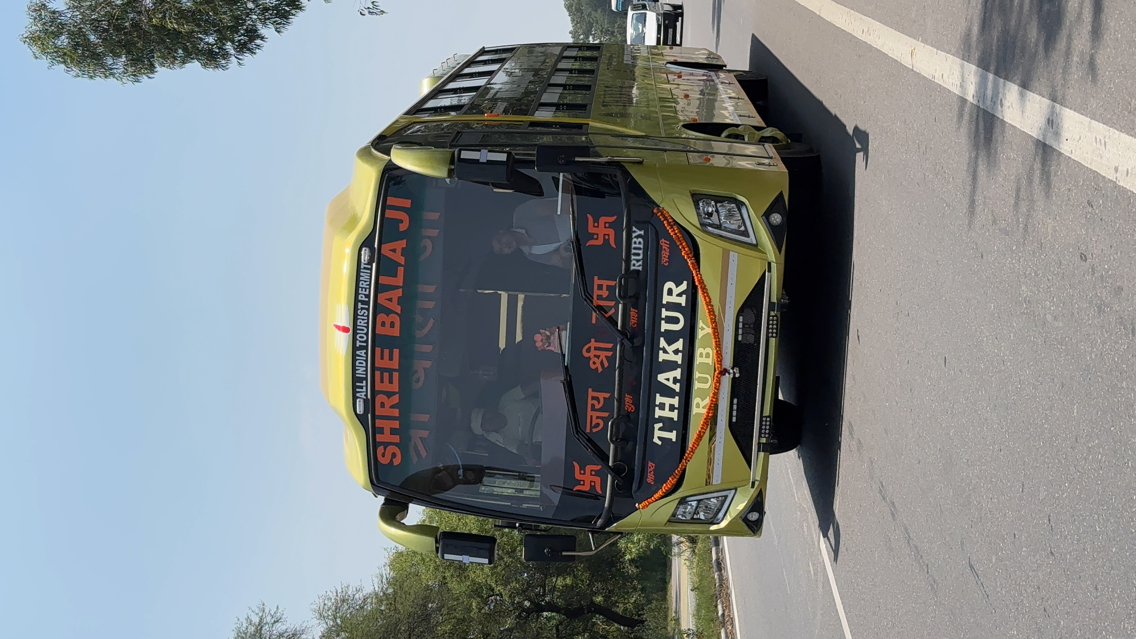 Bus on highway at sunset